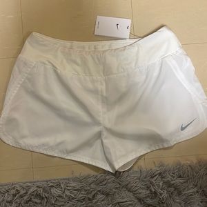 New with tags. Women’s Nike running shorts, size large.